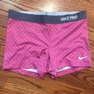 Purple Nike Pros with blue polka dots
